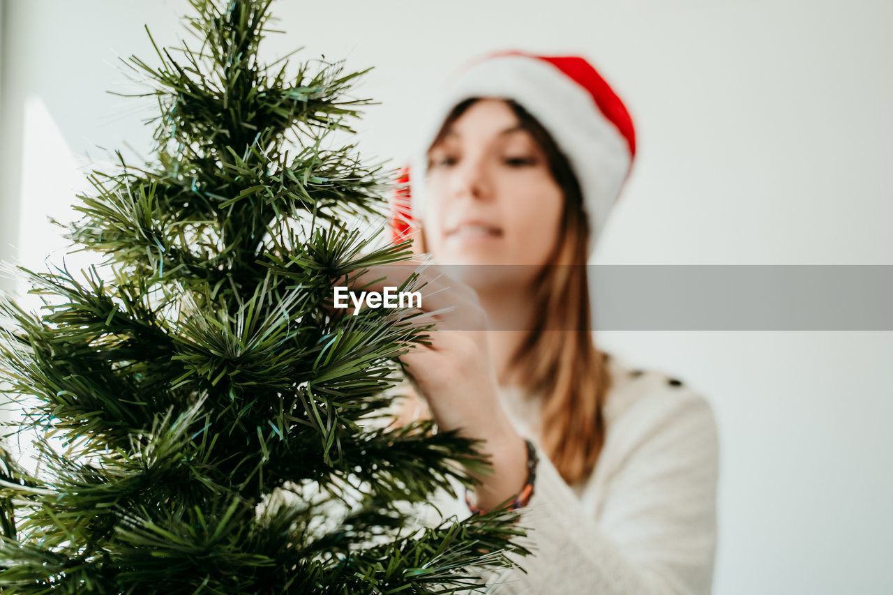 Young woman with christmas tree