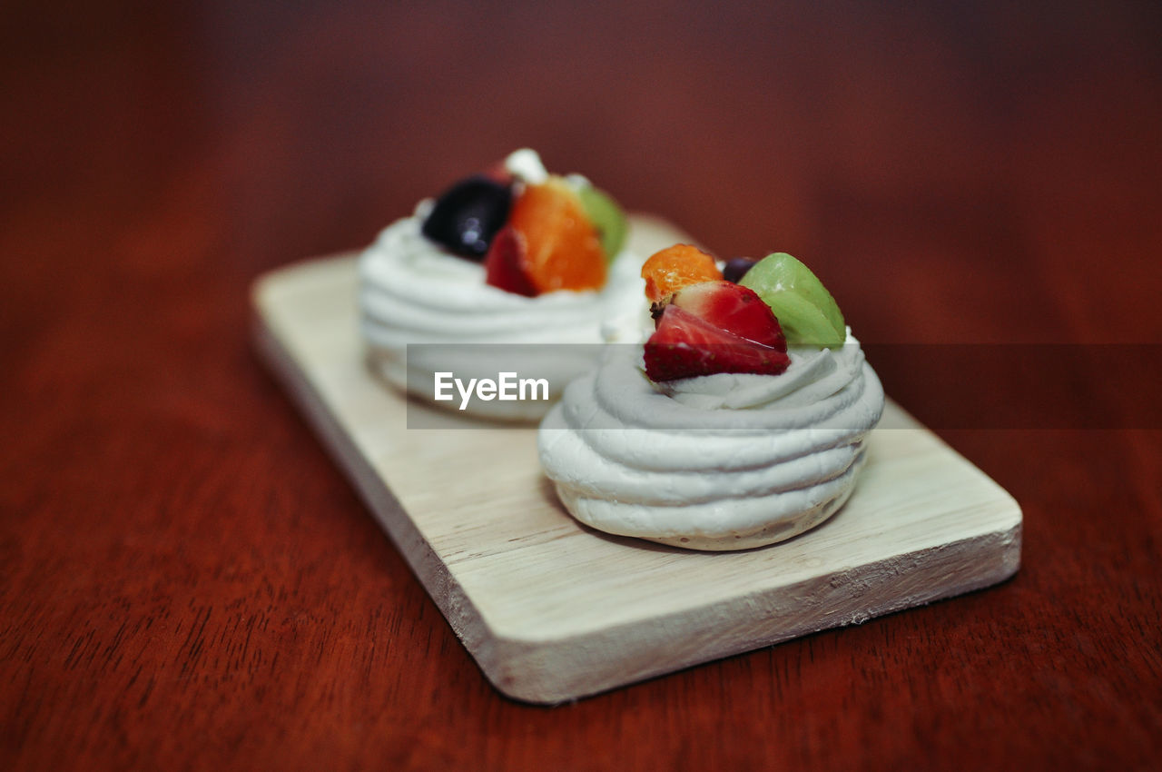 CLOSE-UP OF DESSERT SERVED IN PLATE ON TABLE