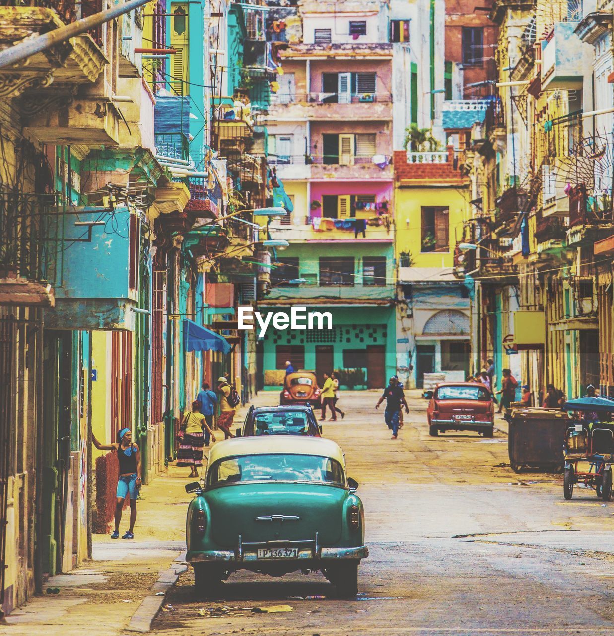 Cars on street by buildings in city