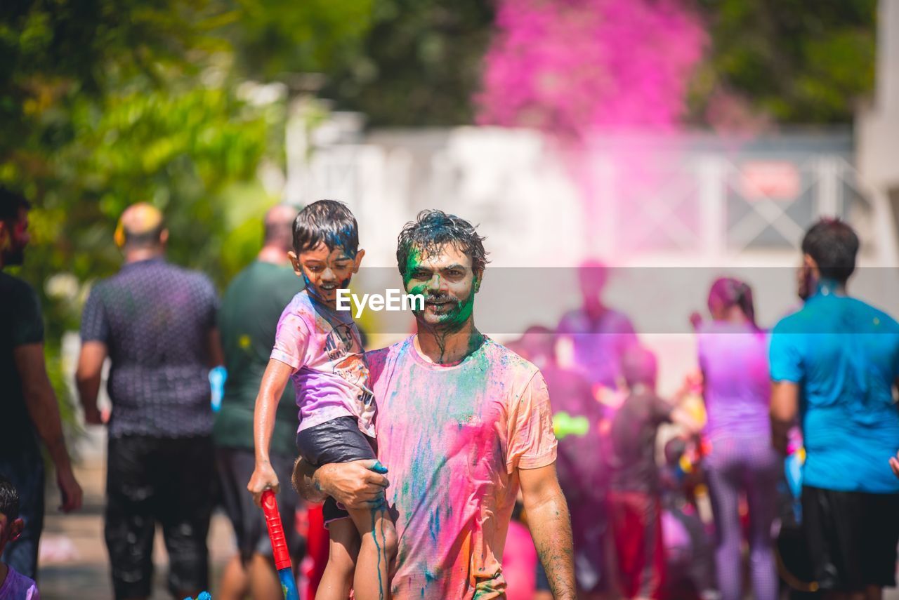 Portrait of man with face paint standing outdoors