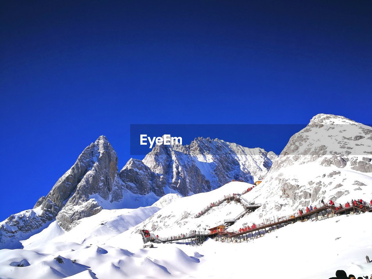 Scenic view of snowcapped mountains against clear blue sky
in jade dragon snow mountain 