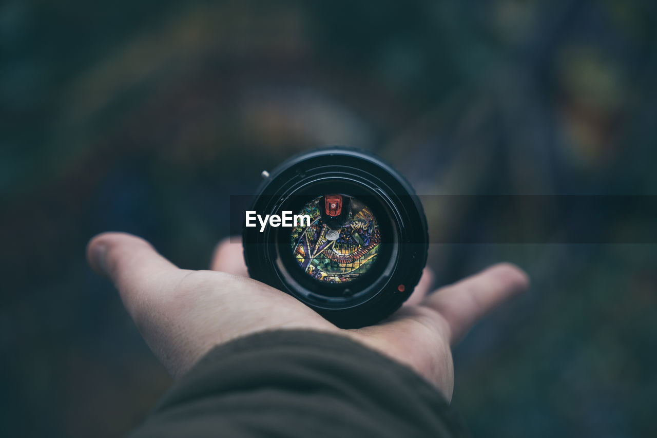 CLOSE-UP OF PERSON PHOTOGRAPHING