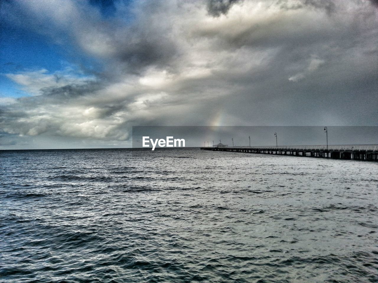 SEASCAPE AGAINST CLOUDY SKY