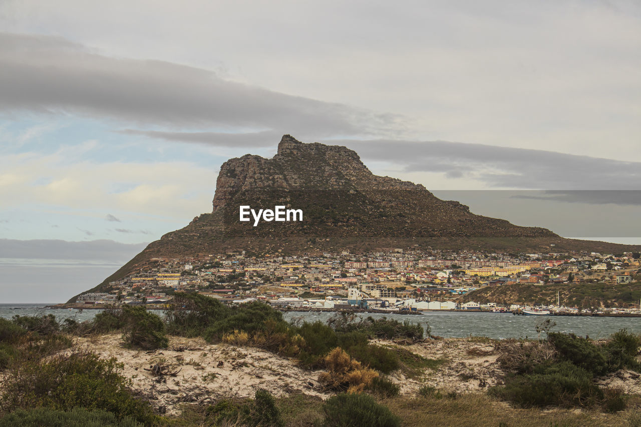 The view of the sentinel during early morning from hout bay beach near cape town, south africa.