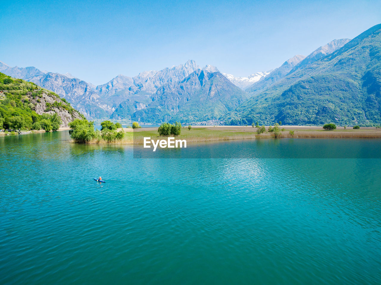 VIEW OF LAKE AGAINST MOUNTAIN RANGE