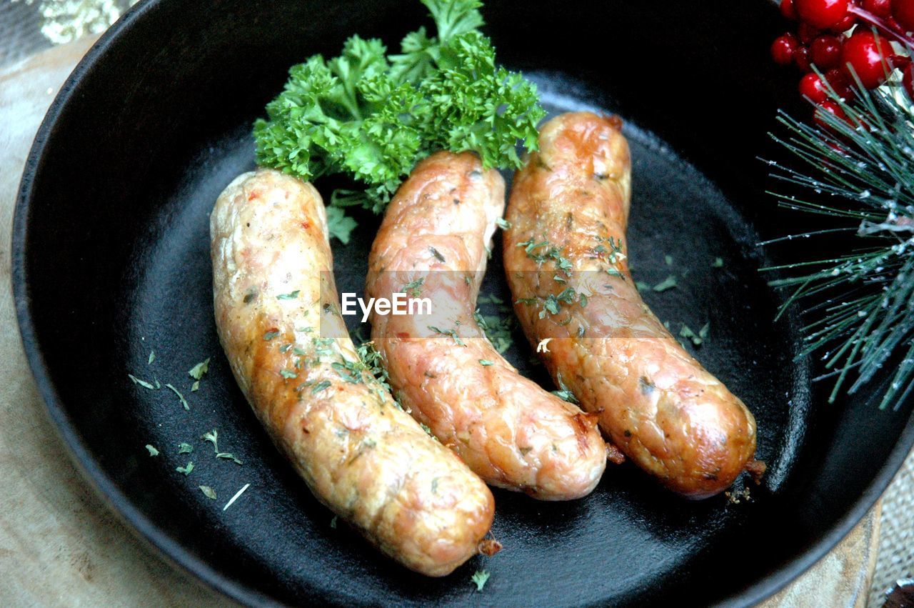 Close-up of sausages in pan