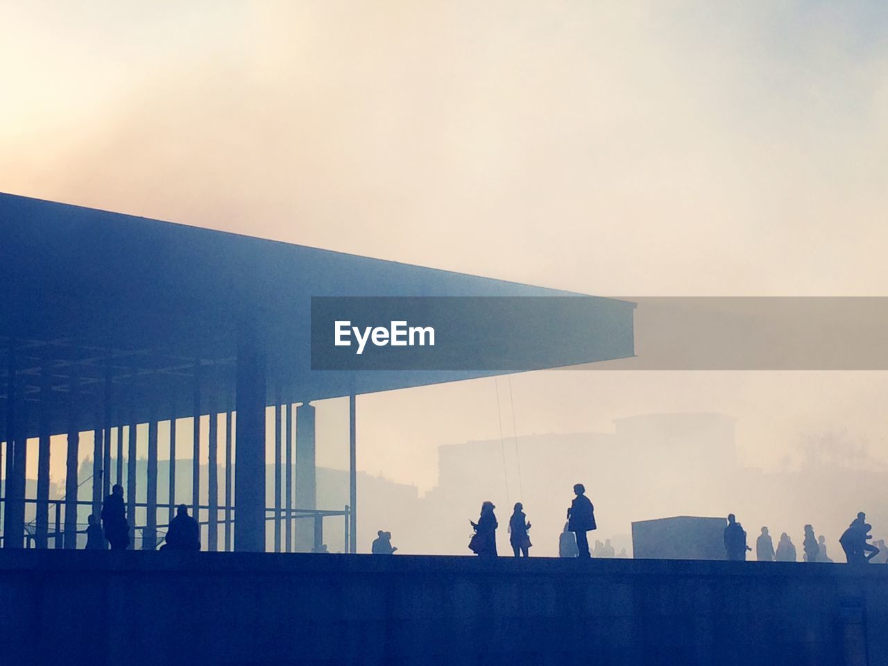 Silhouette people at neue nationalgalerie in foggy weather