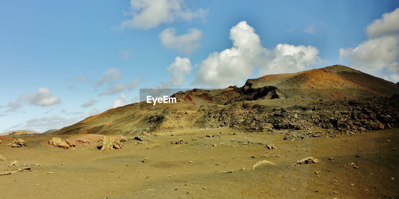 Panoramic view of volcanic landscape against sky