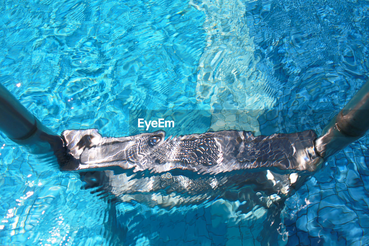 High angle view of ladder in swimming pool