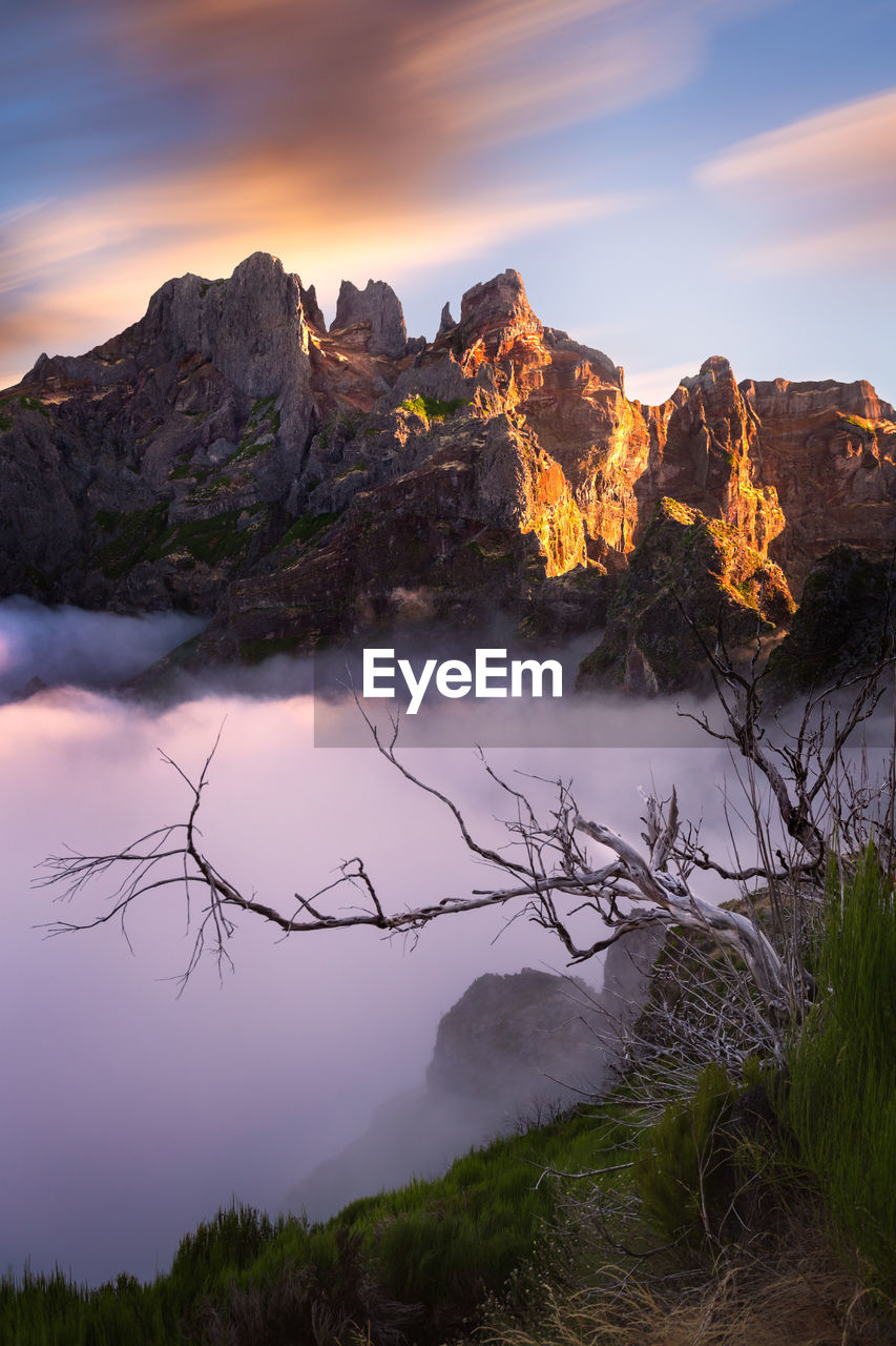 Scenic view of mountains against sky during sunset