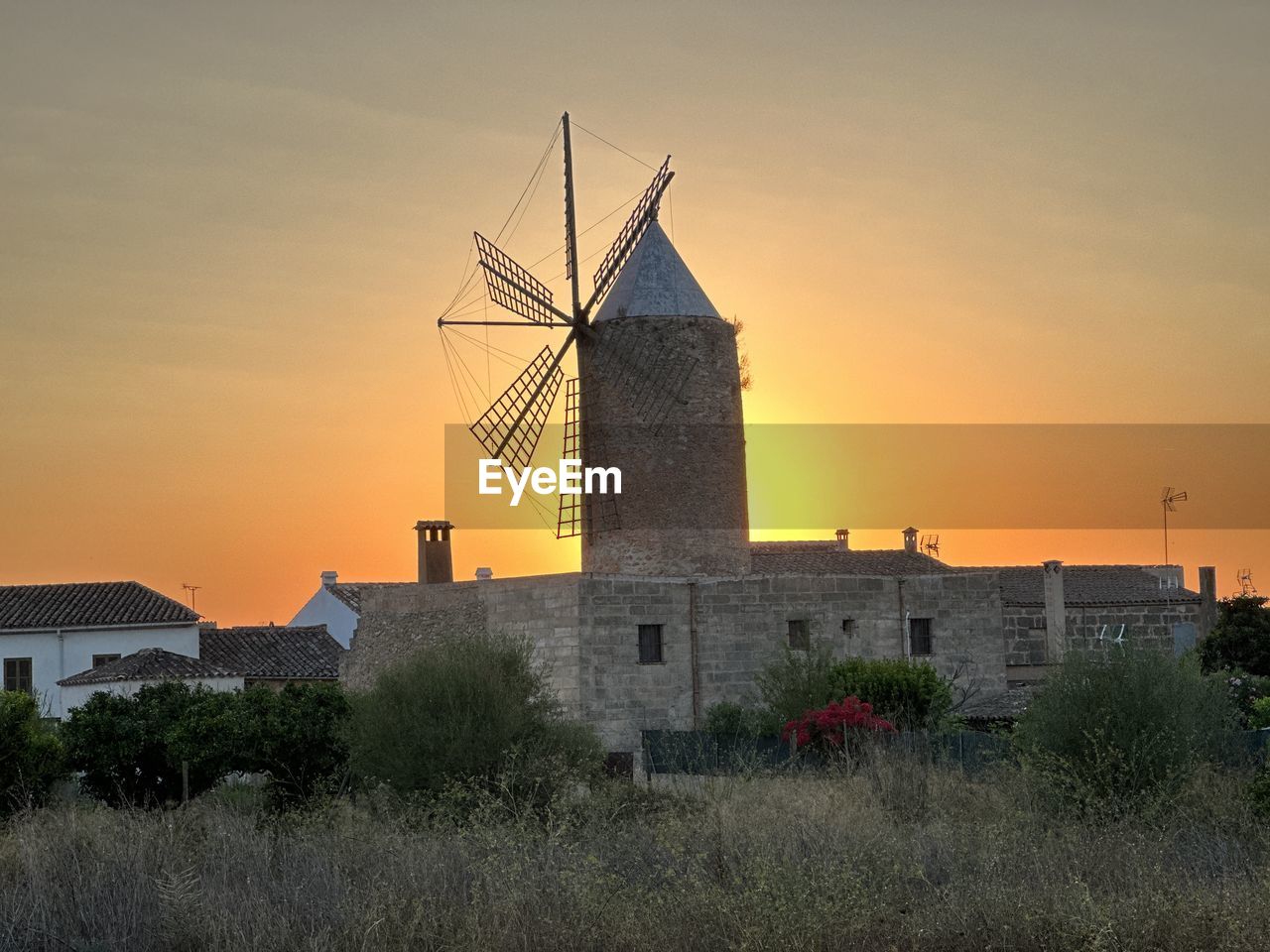 low angle view of church against sky during sunset