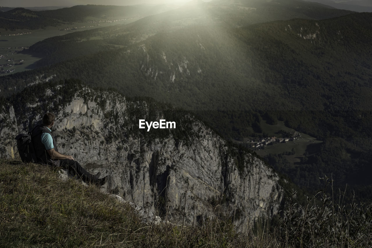 Man looking at view of mountain