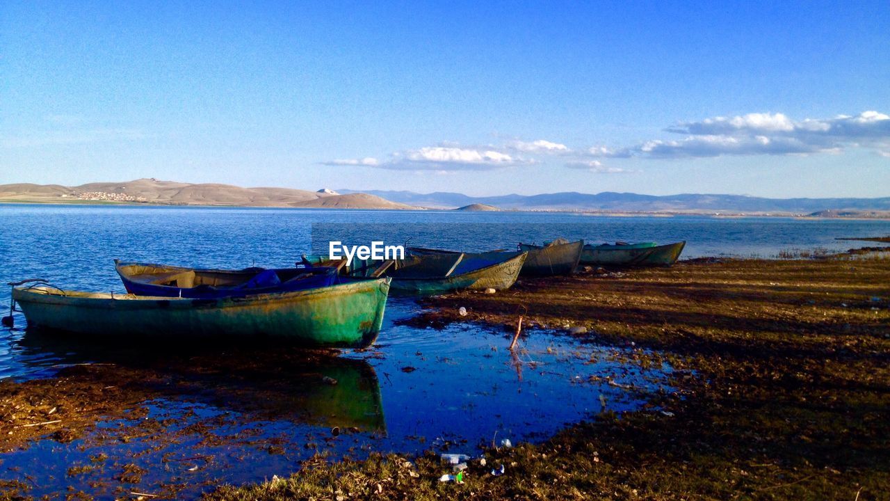 Scenic view of calm sea against cloudy sky