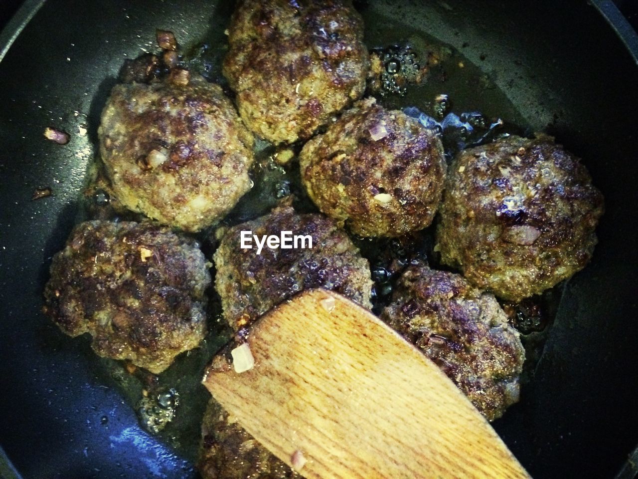 High angle view of patties in cooking pan