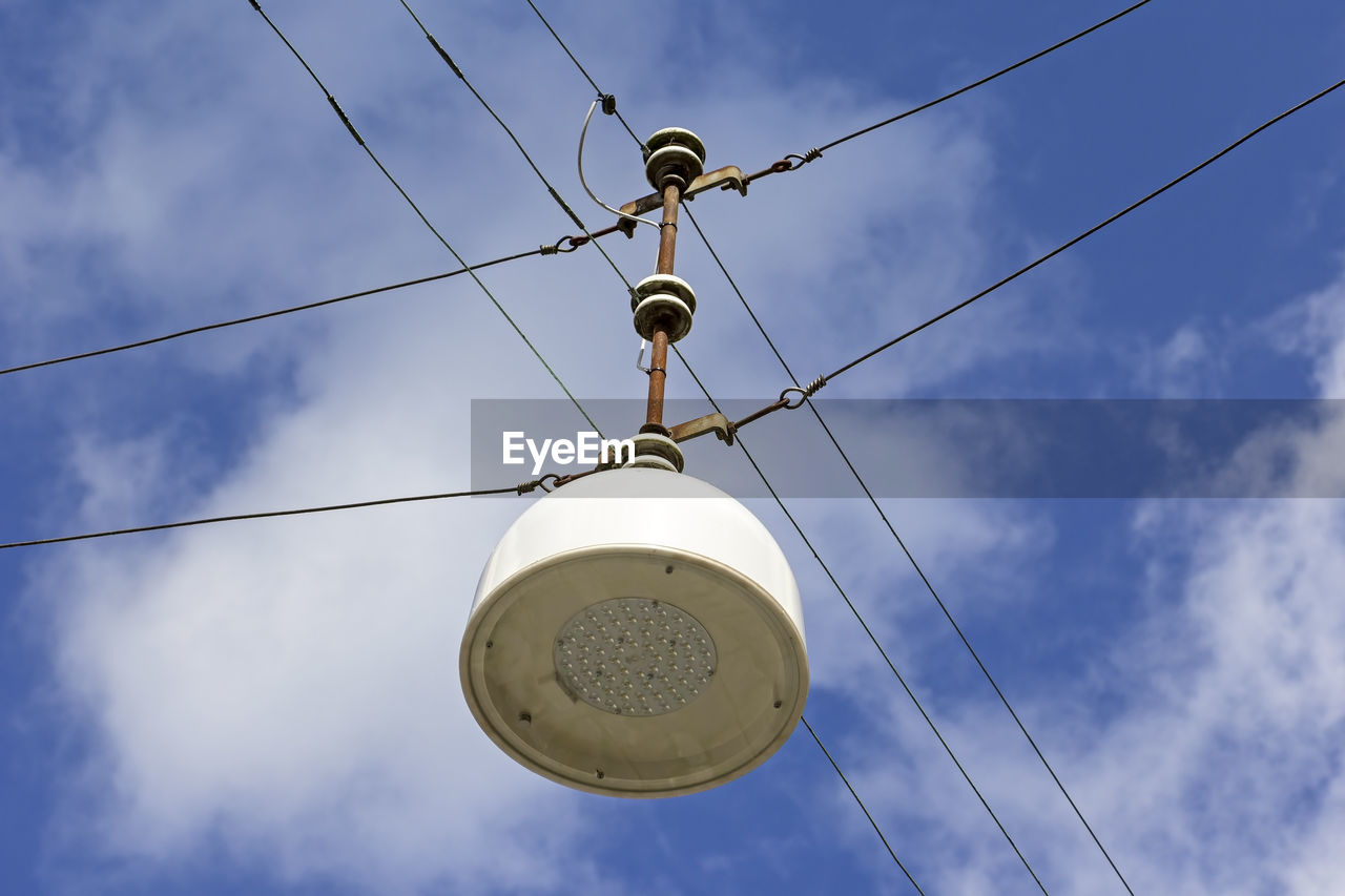 Low angle view of cables against sky