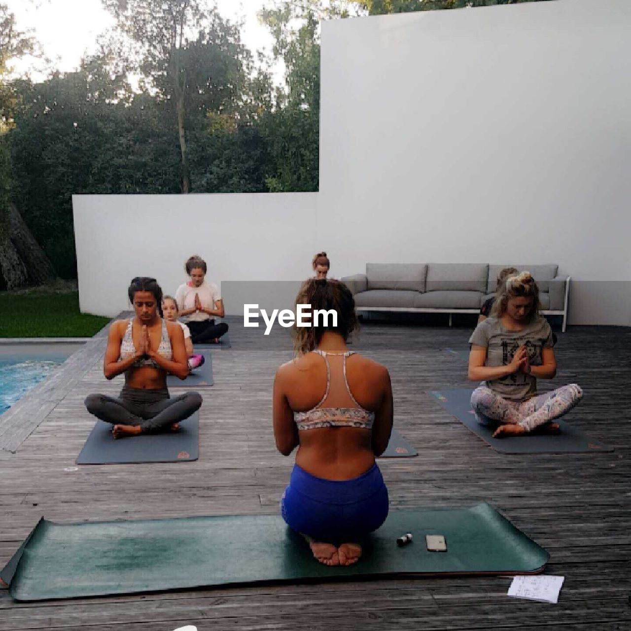 CHILDREN LOOKING AT SITTING OUTDOORS