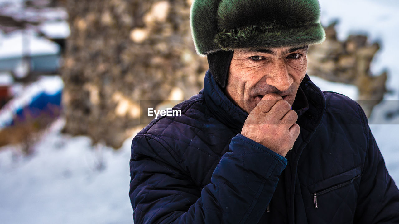 PORTRAIT OF MAN IN SNOW