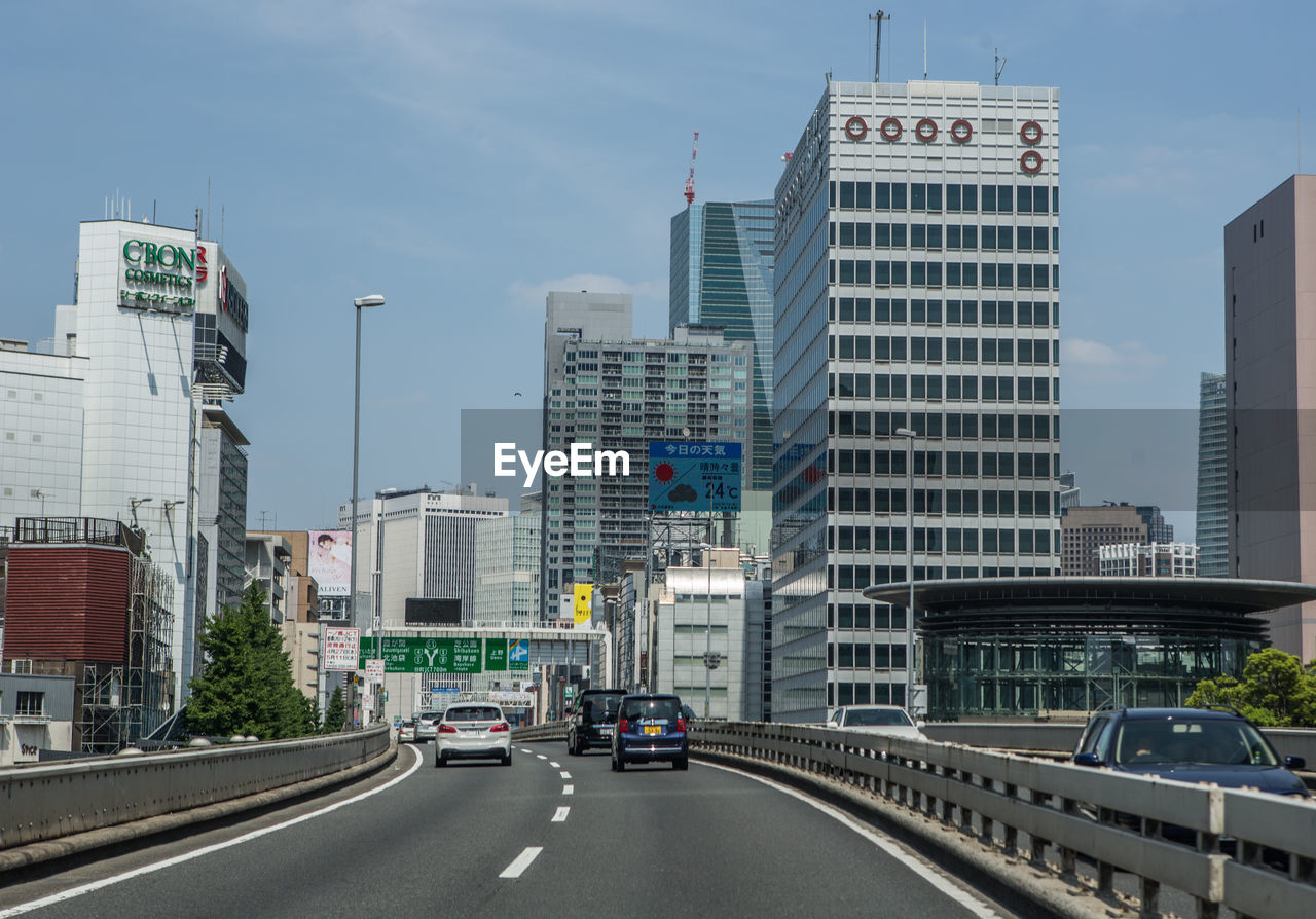 VIEW OF CITY STREET AGAINST SKY