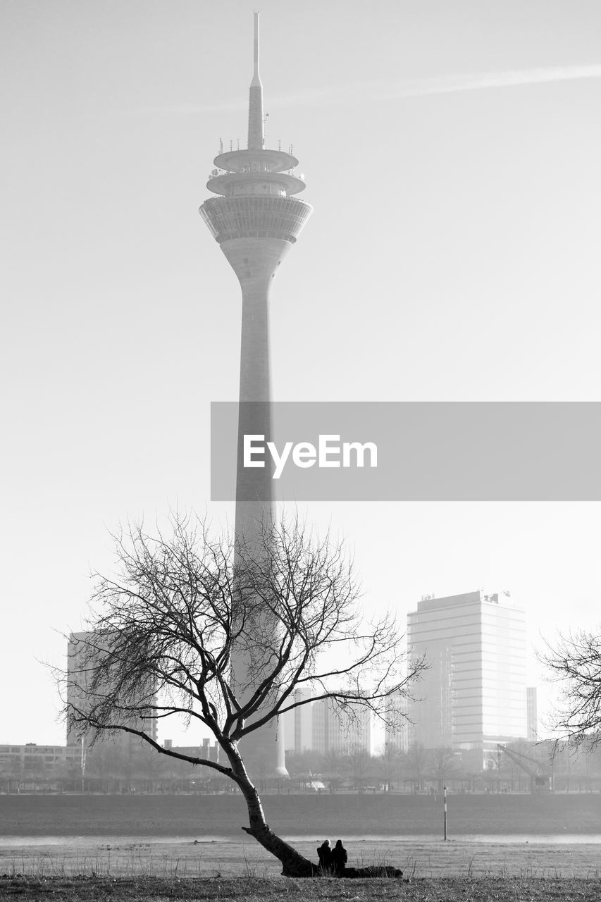 LOW ANGLE VIEW OF COMMUNICATIONS TOWER AGAINST CLEAR SKY