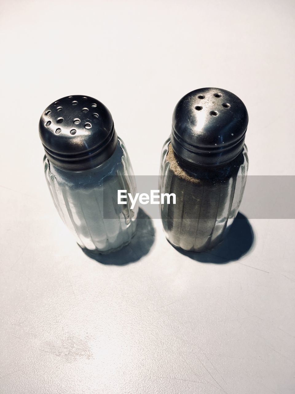 High angle view of salt and pepper on table