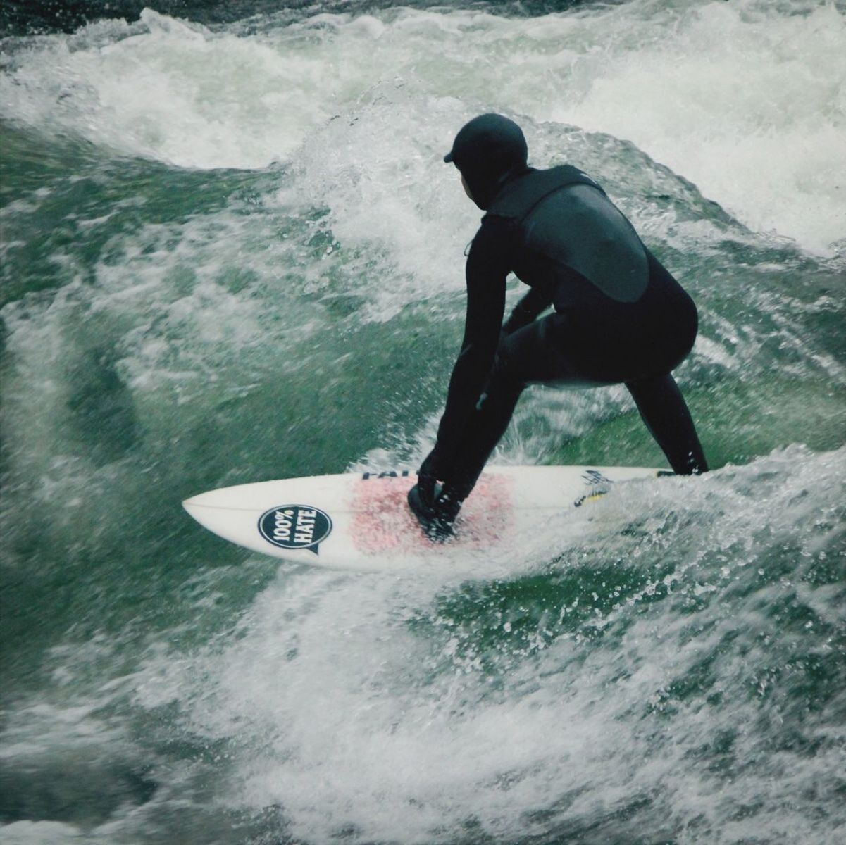 PEOPLE SURFING IN SEA