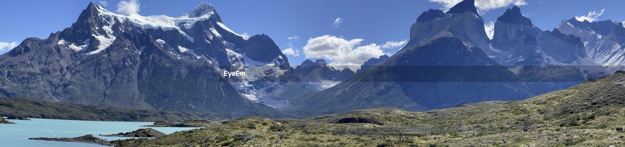 panoramic view of snowcapped mountains against sky