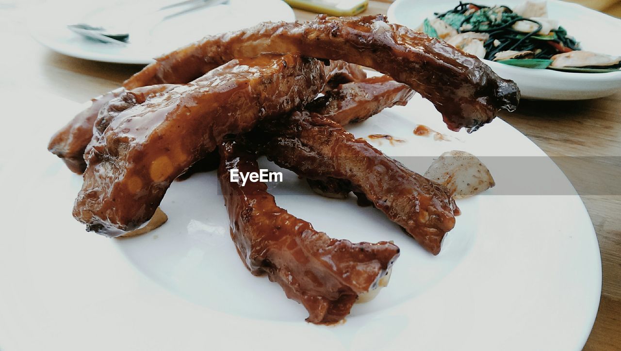 Close-up of grilled pork ribs on plate