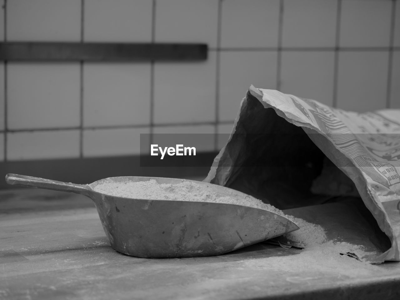 Close-up of cement in scoop on table at home