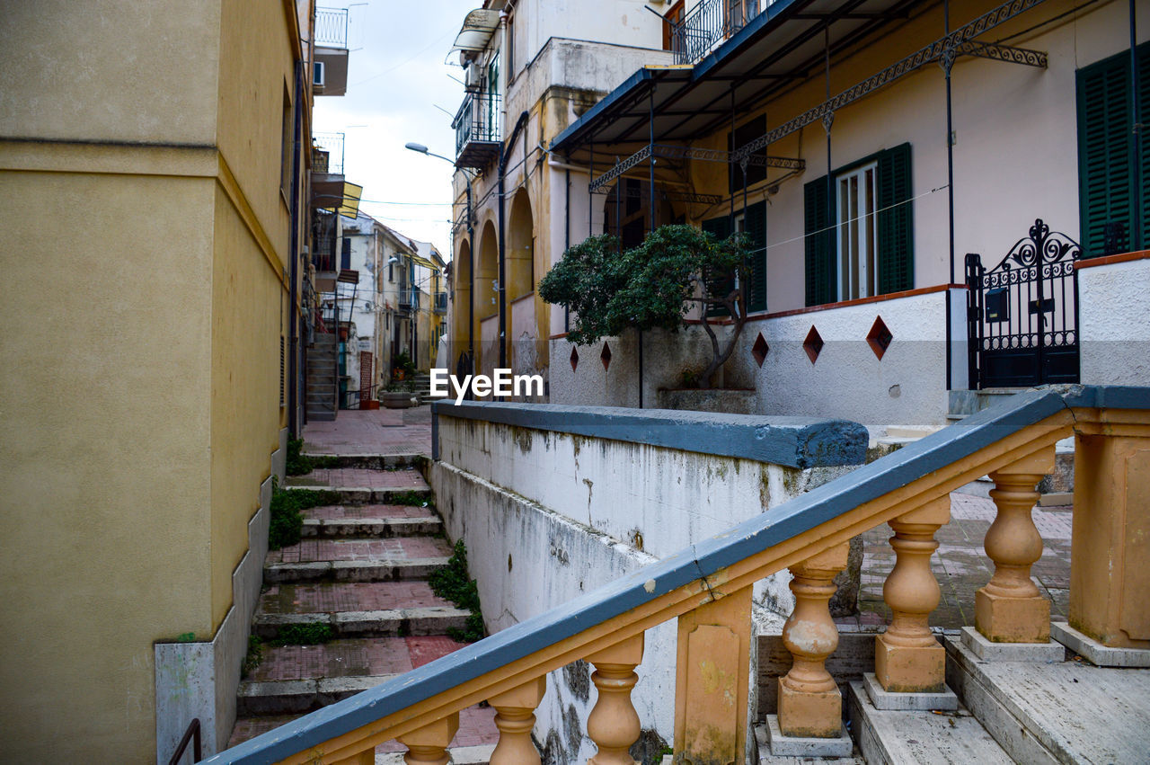 A beautifully constructed set of stairs leading up to a tall building