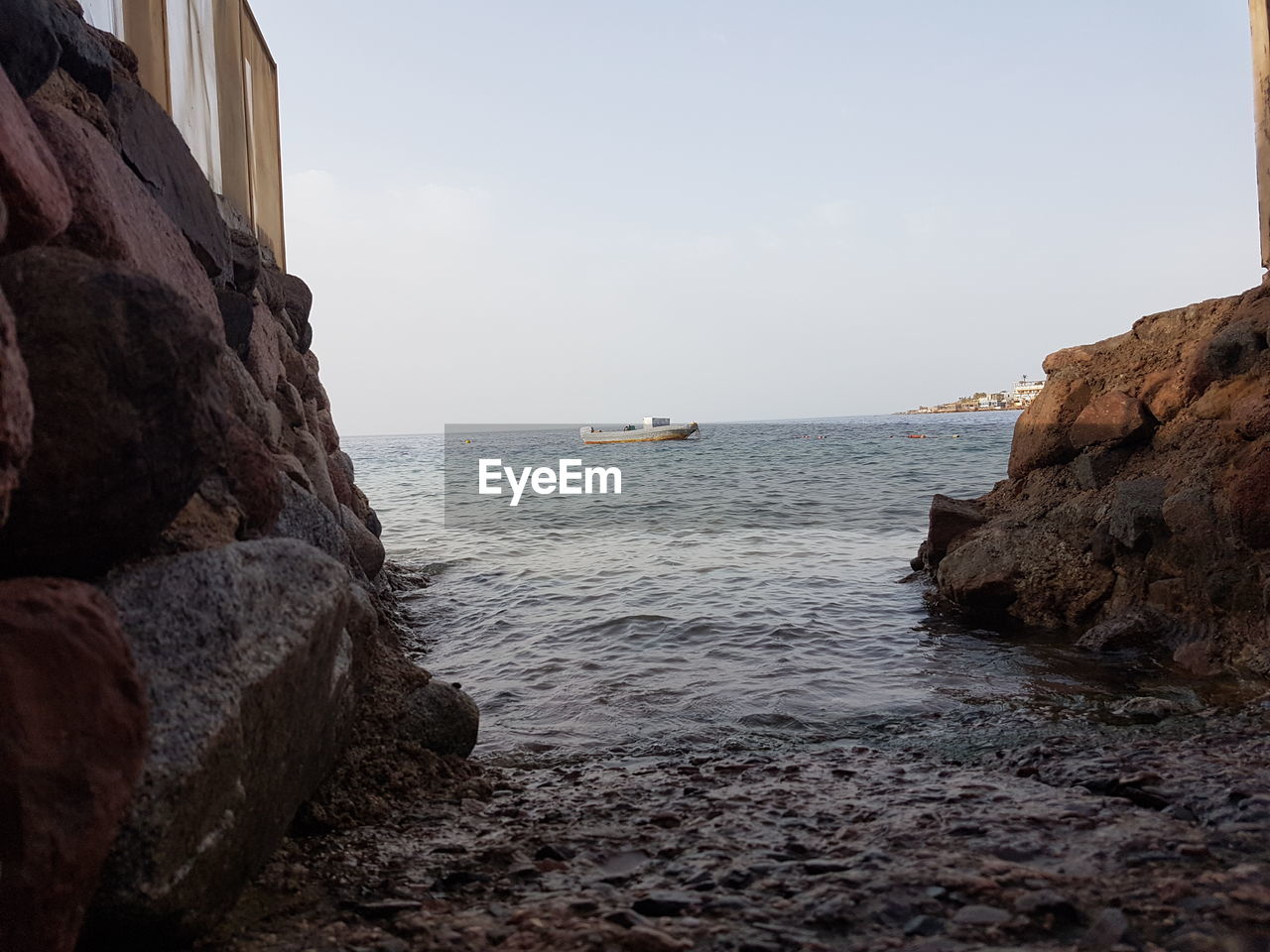 SCENIC VIEW OF SEA AND ROCKS