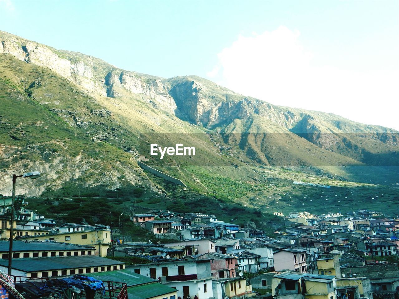 VIEW OF TOWN AGAINST MOUNTAIN RANGE