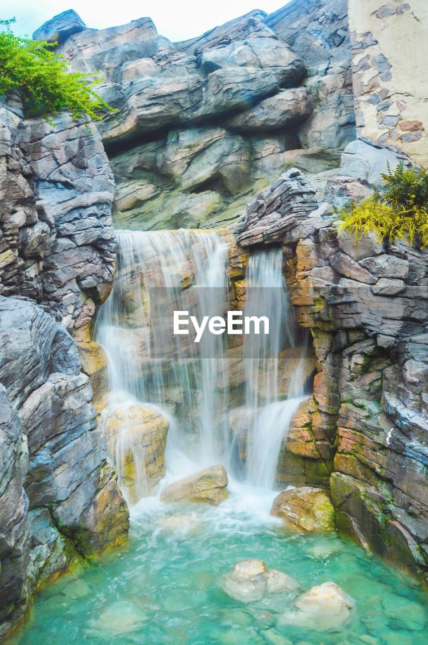 VIEW OF WATERFALL IN FOREST