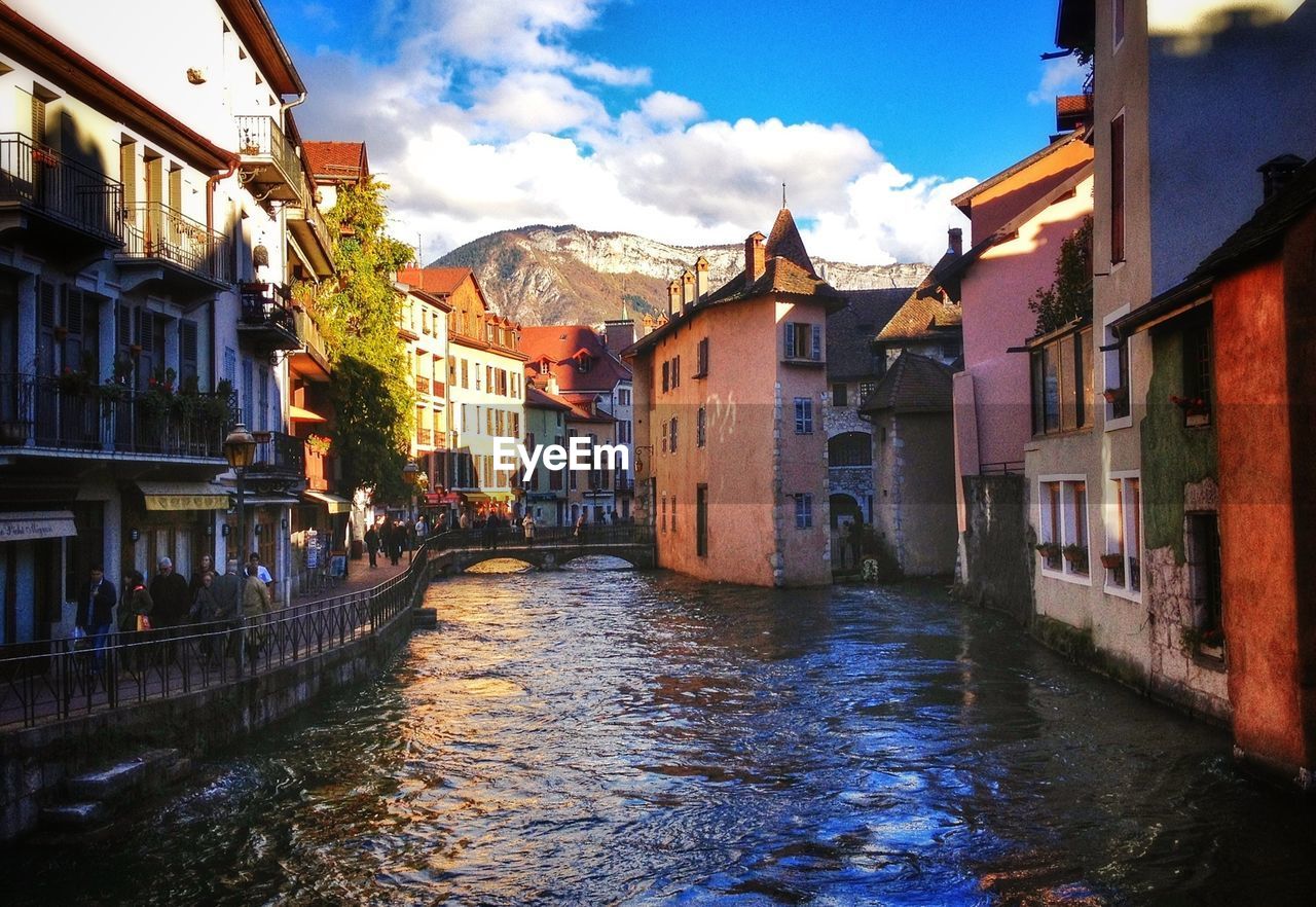 Canal amidst buildings in city