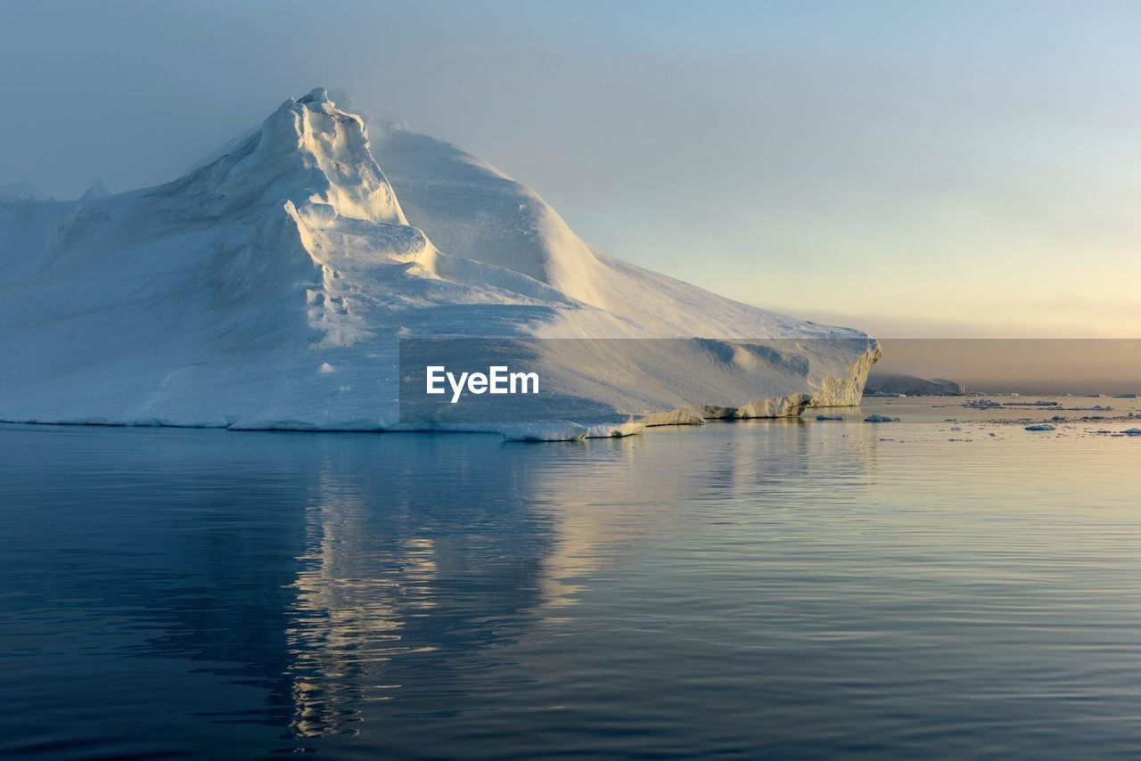 Scenic view of lake with mountains in background