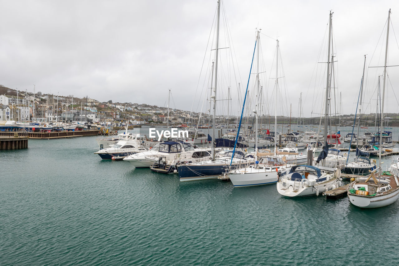 Landscape photo of boats floating in the harbor in falmouth