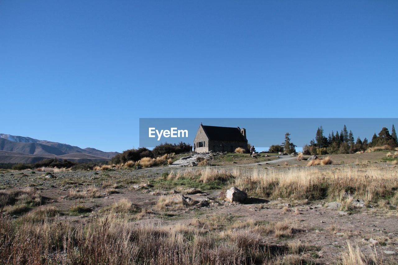 View of landscape against clear blue sky