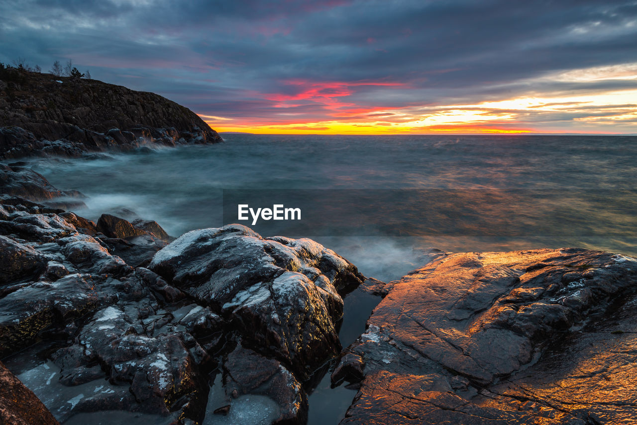 Scenic view of sea against sky during sunset