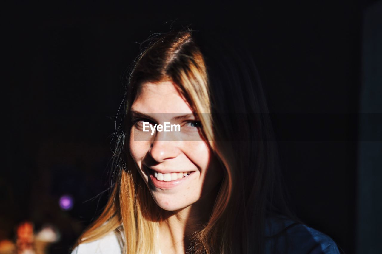 Close-up portrait of smiling woman
