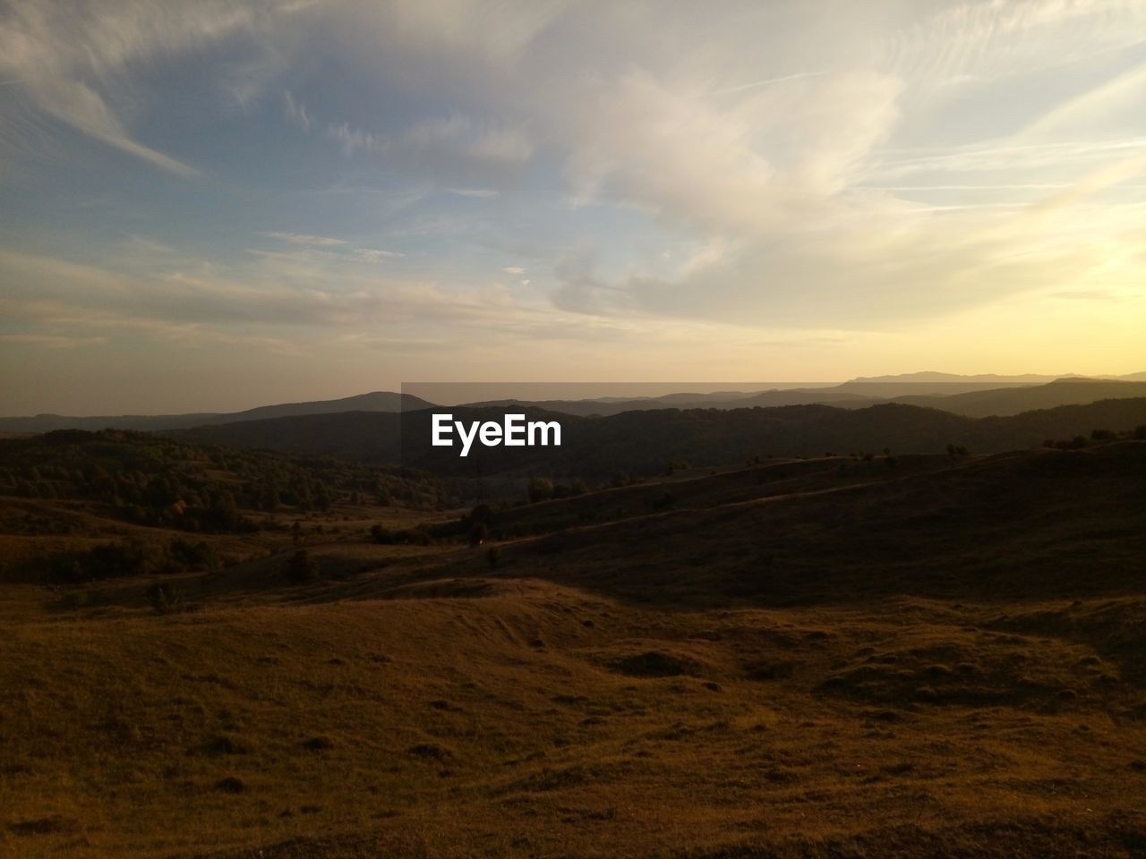 Scenic view of landscape against sky during sunset