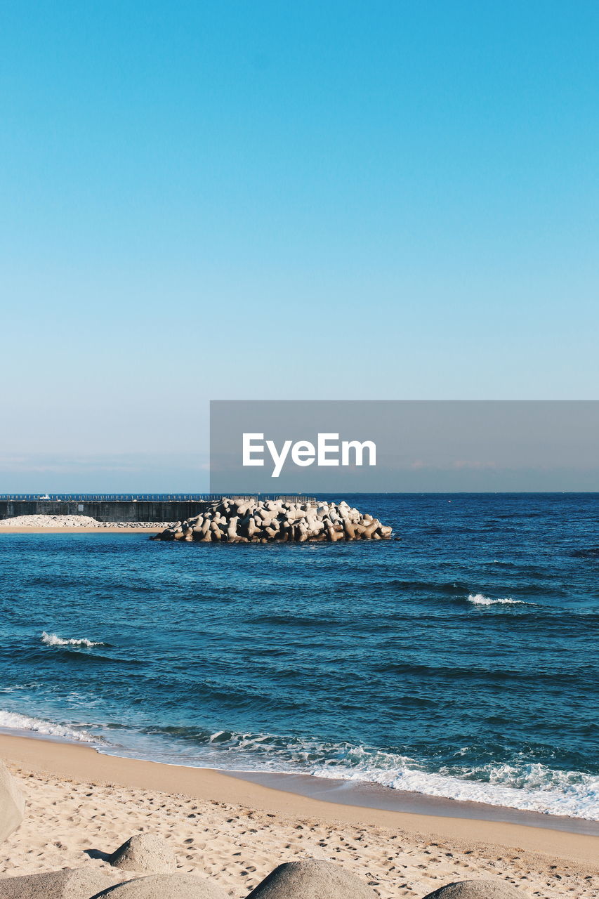 Scenic view of sea against clear sky