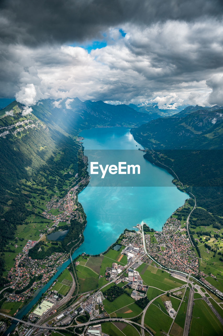 Aerial view of sea and mountains against sky