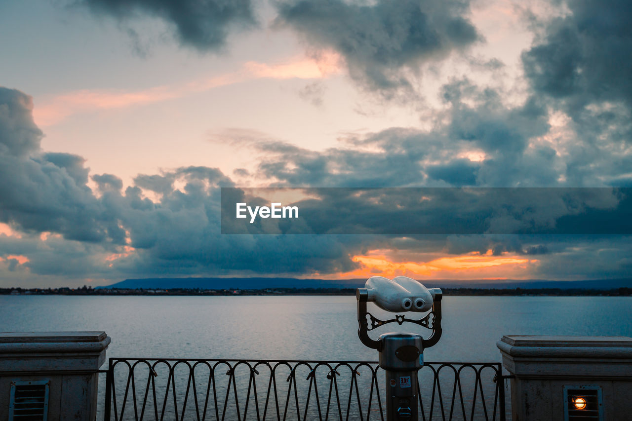 Panoramic sea binoculars with spectacular sunset in the background