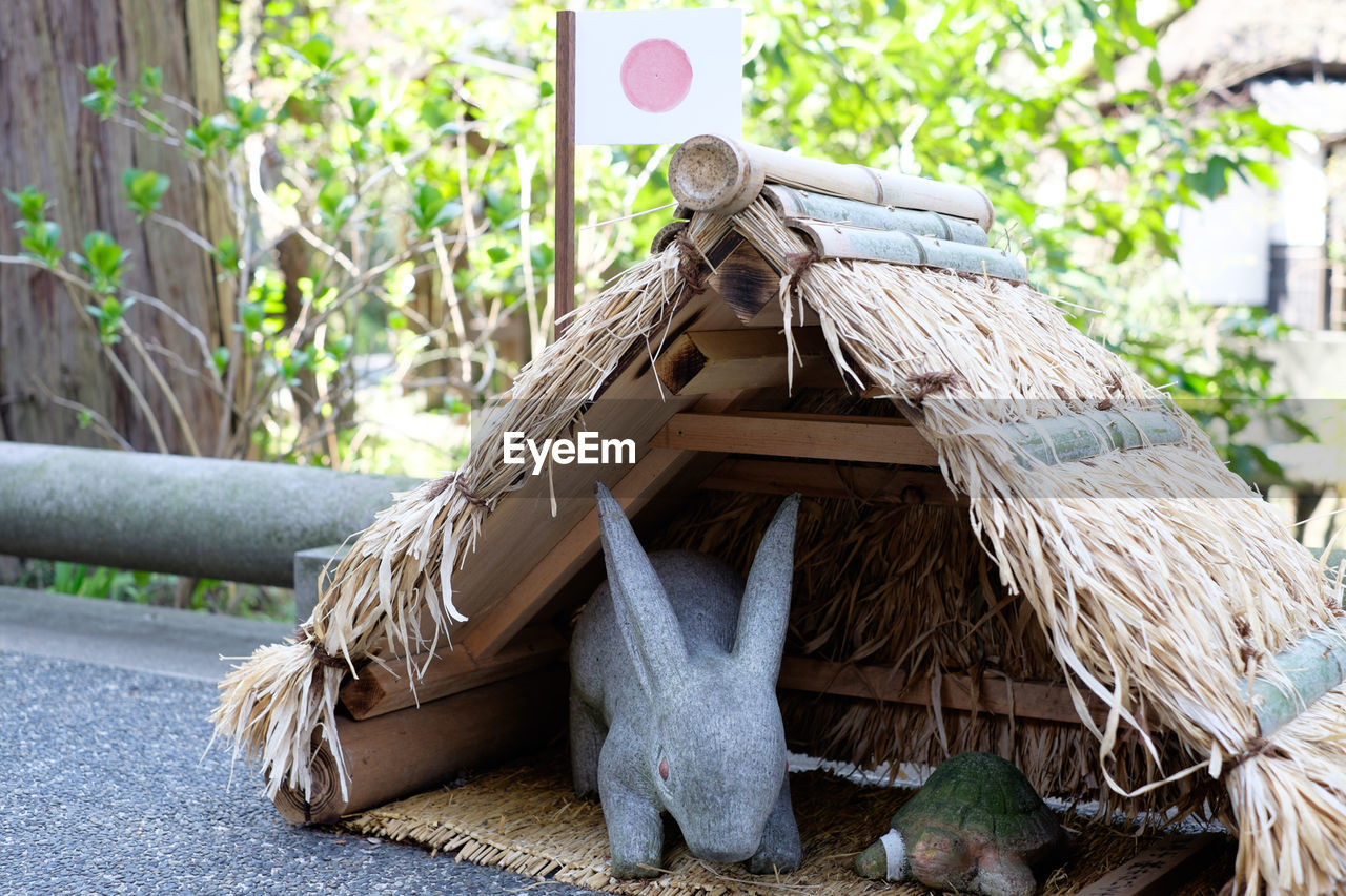 Close-up of figurines in hut