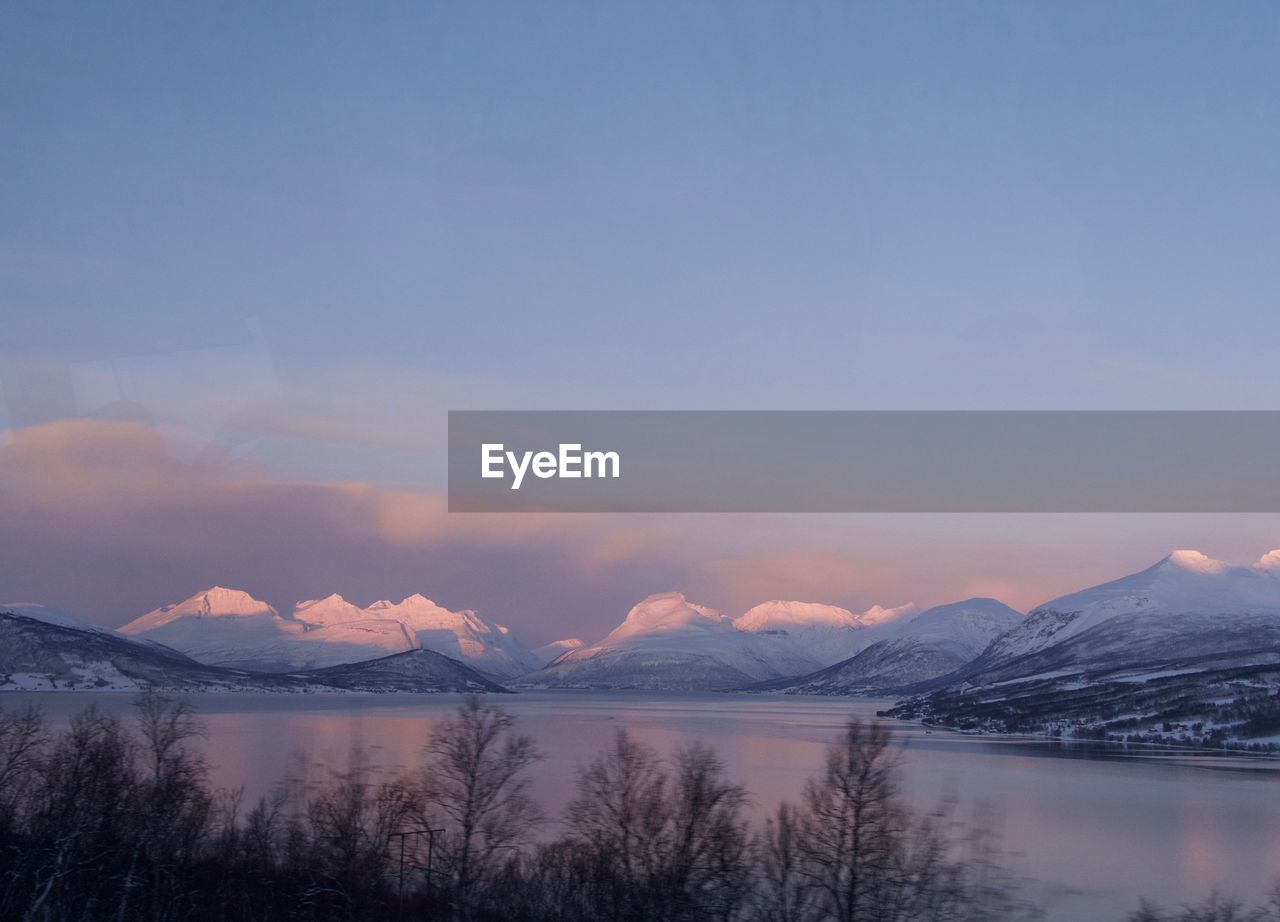 View to sunrise above the fjord in norway in winter