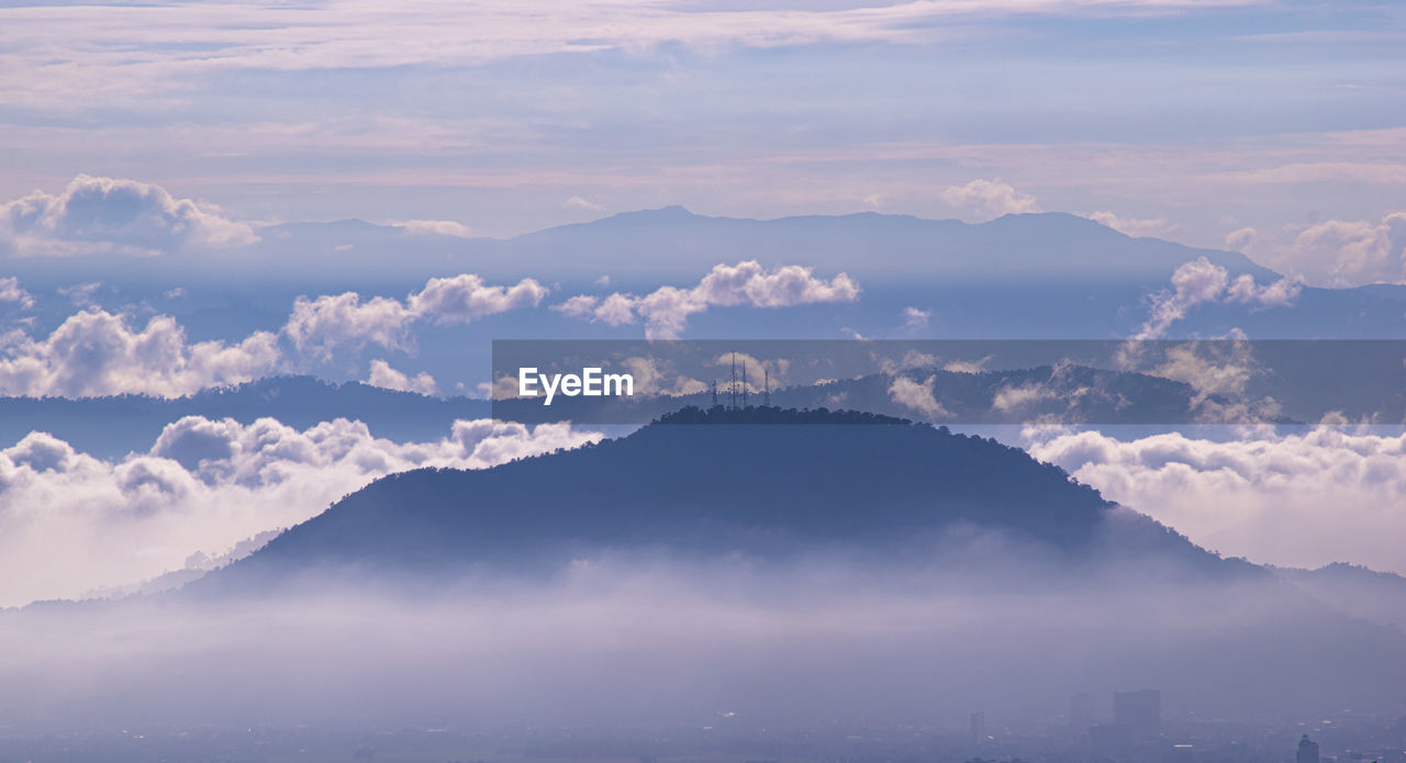 Scenic view of mountains against sky during sunset