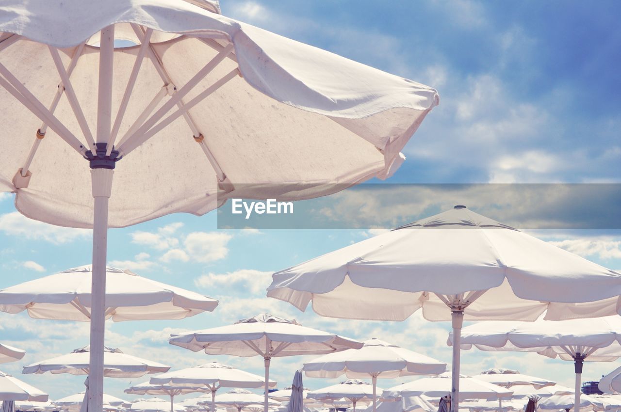 Beach umbrellas against sky