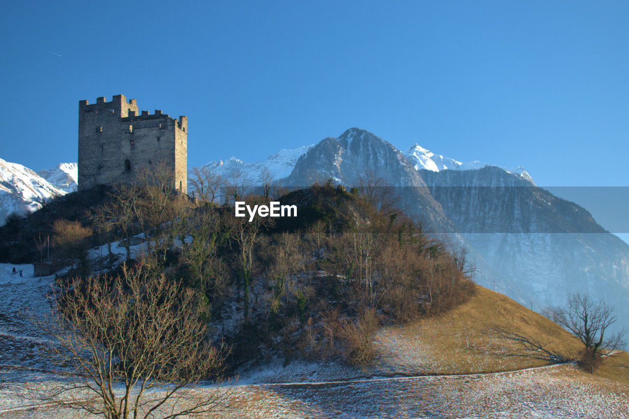 Historic old ruin in a beautiful mountain panorama in wartau in switzerland 10.1.2021