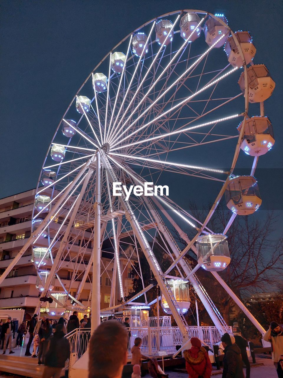 ferris wheel, amusement park ride, amusement park, arts culture and entertainment, recreation, night, sky, leisure activity, illuminated, architecture, traveling carnival, carnival, fun, nature, travel destinations, circle, enjoyment, fair, low angle view, geometric shape, no people, outdoors, shape, built structure, park