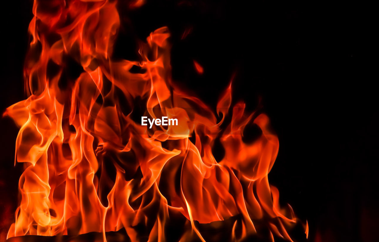 Close-up of bonfire on black background