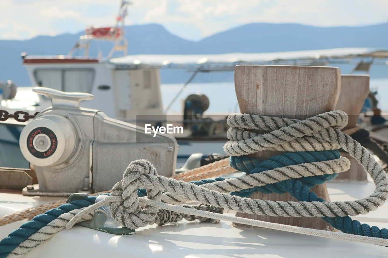 Close-up of nautical vessel on sea against sky